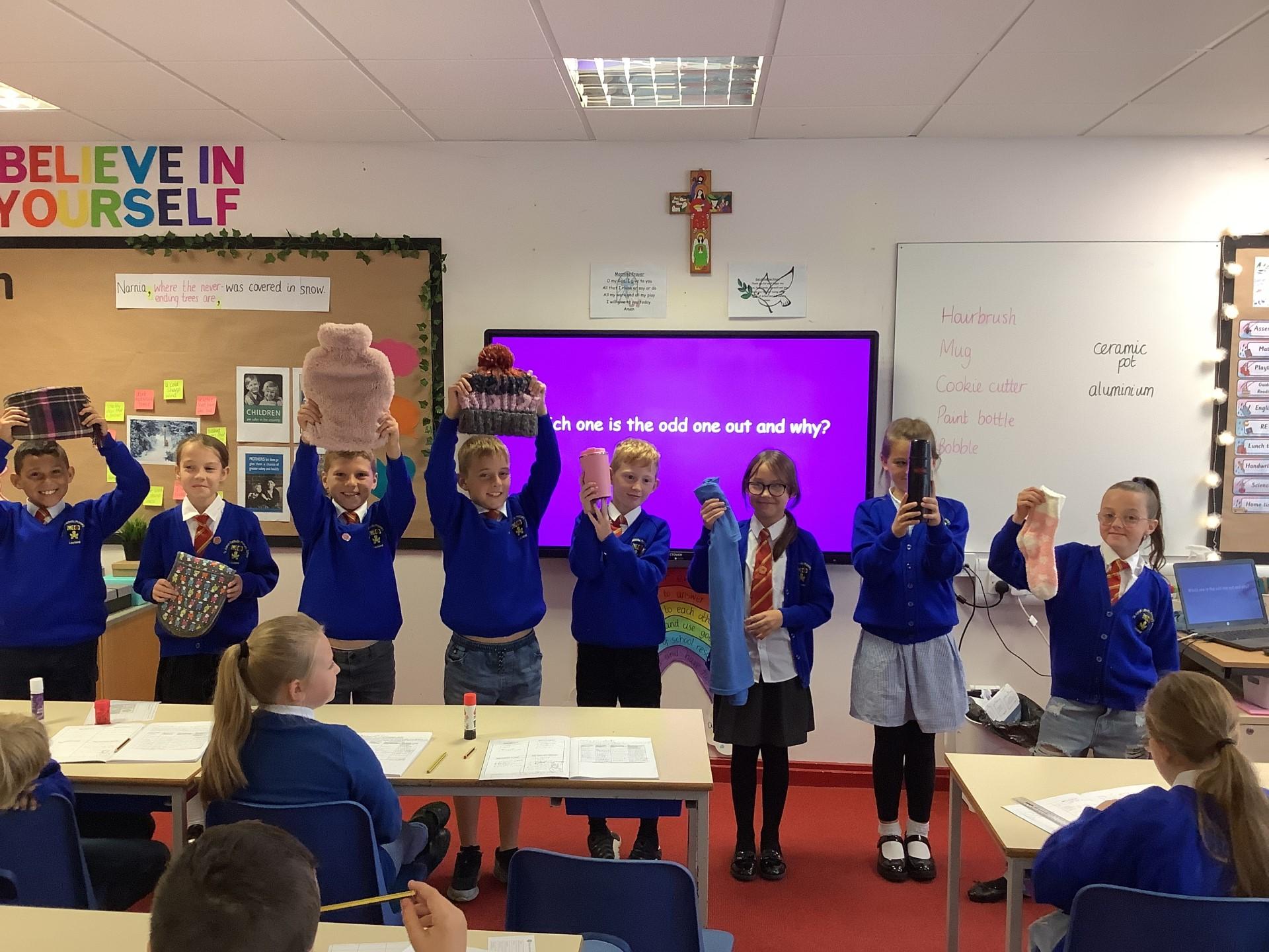 We have been learning about conductors and insulators. The tshirt is the odd one out!